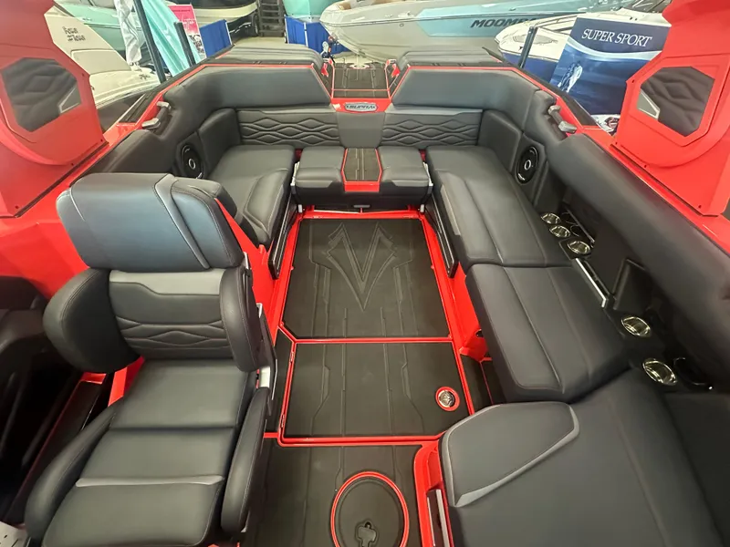 Slide: The Image of Luxurious interior of 2025 Supra SA 450 boat with sleek black and red seating. - 7
