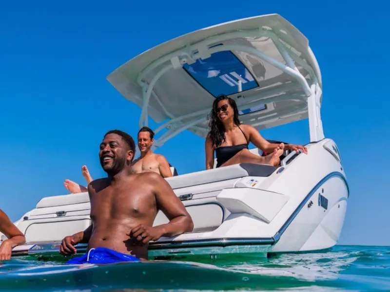 Slide: The Image of 2024 Yamaha Boats 275SD with people enjoying the water and sun. - 4