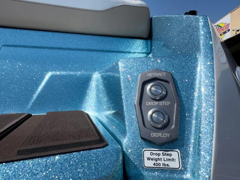 Slide: The Image of 2025 Supra SL 550 boat with glittery blue finish and drop step controls. - 10