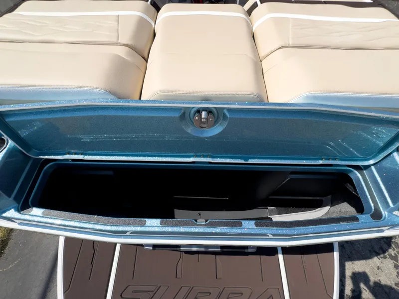 Slide: The Image of 2025 Supra SL 550 boat with open rear storage compartment. - 13