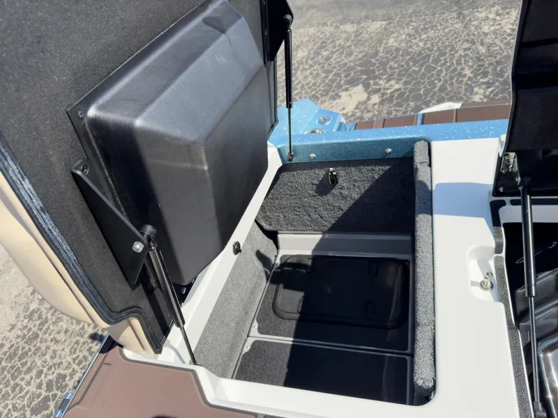 Slide: The Image of 2025 Supra SL 550 storage compartment with open lid, showcasing interior space. - 18