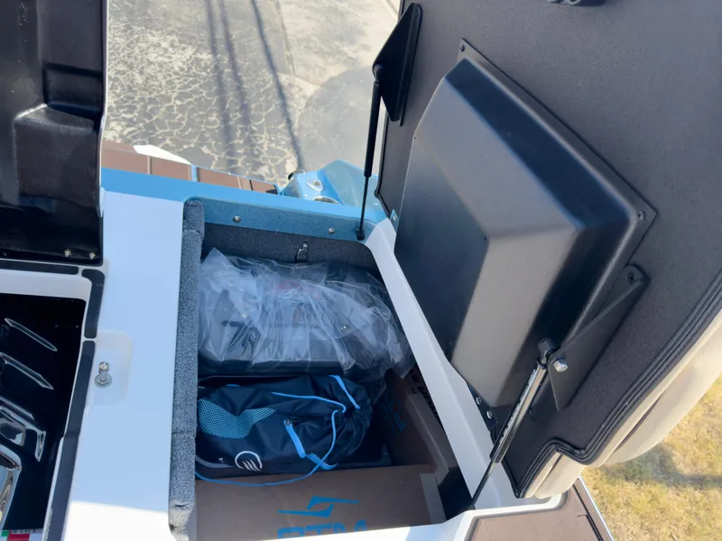 Slide: The Image of 2025 Supra SL 550 storage compartment with gear and accessories. - 19