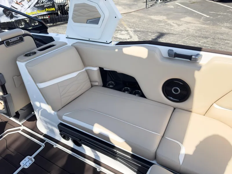 Slide: The Image of 2025 Supra SL 550 boat interior with beige seating and speaker system. - 20