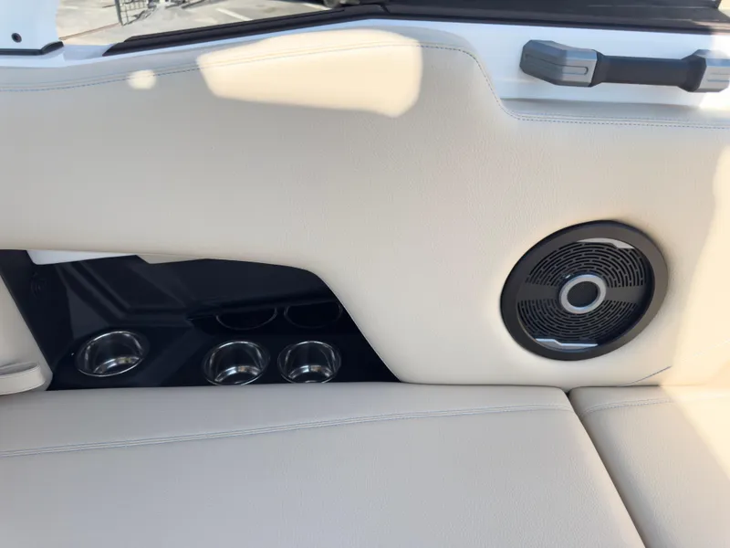 Slide: The Image of 2025 Supra SL 550 interior with speaker and cup holders. - 22