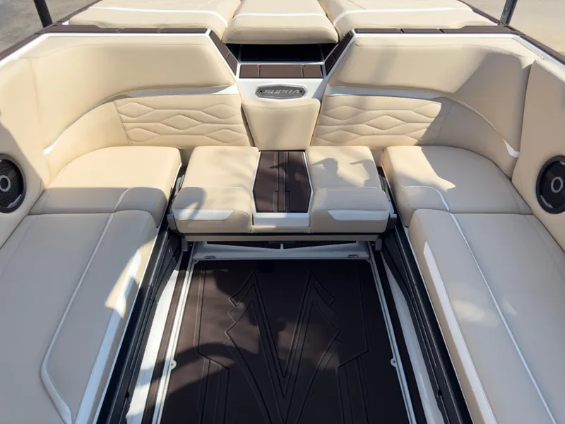 Slide: The Image of 2025 Supra SL 550 boat interior with beige seating and sleek design. - 29