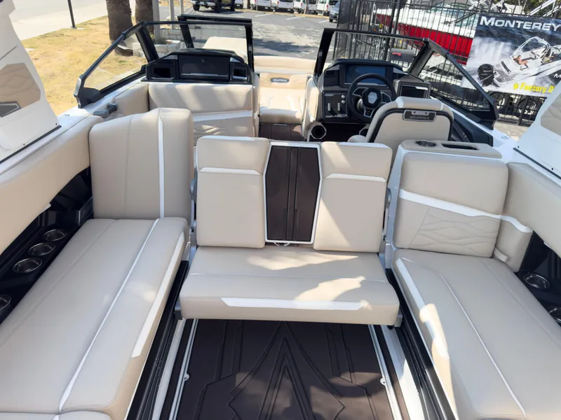 Slide: The Image of 2025 Supra SL 550 boat interior with beige seating and modern dashboard. - 31