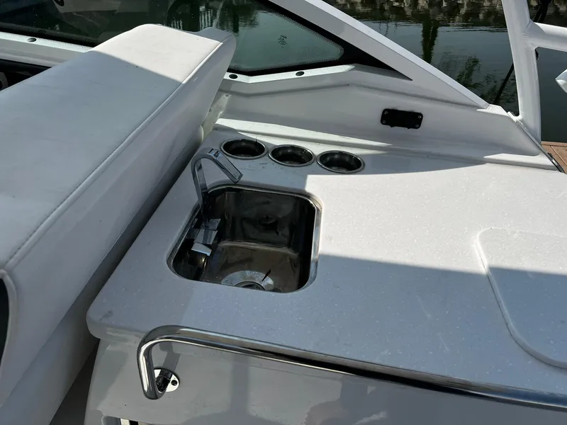 Slide: The Image of 2023 Blackfin 272 DC boat sink and cup holders on deck. - 25