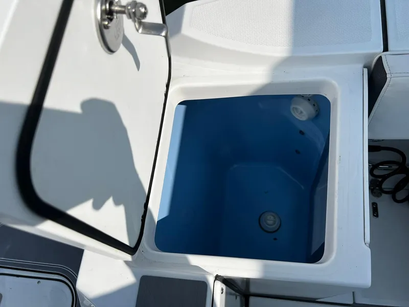 Slide: The Image of Open storage compartment on 2023 Blackfin 272 DC boat. - 29