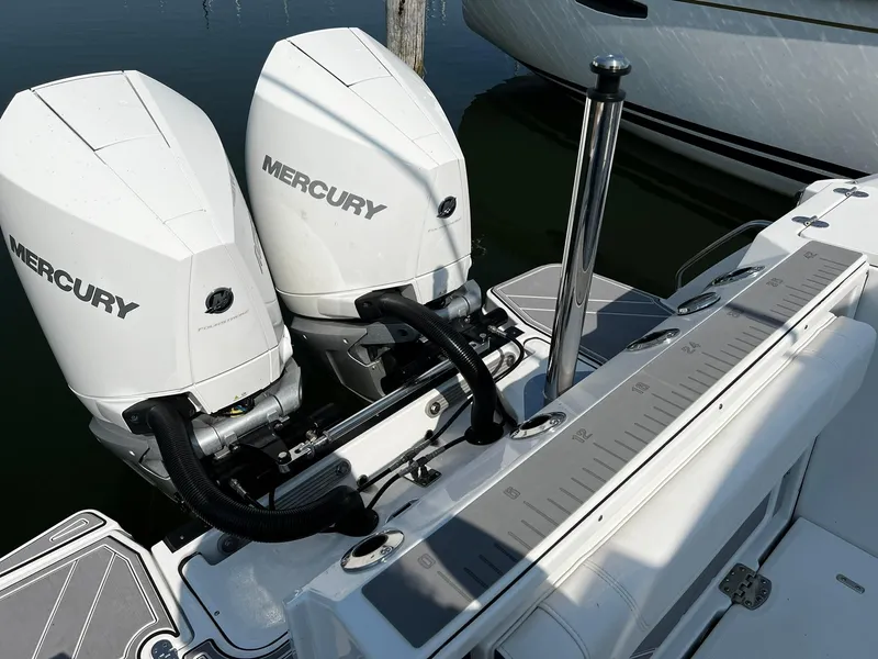 Slide: The Image of 2023 Blackfin 272 DC boat with dual Mercury outboard engines. - 35