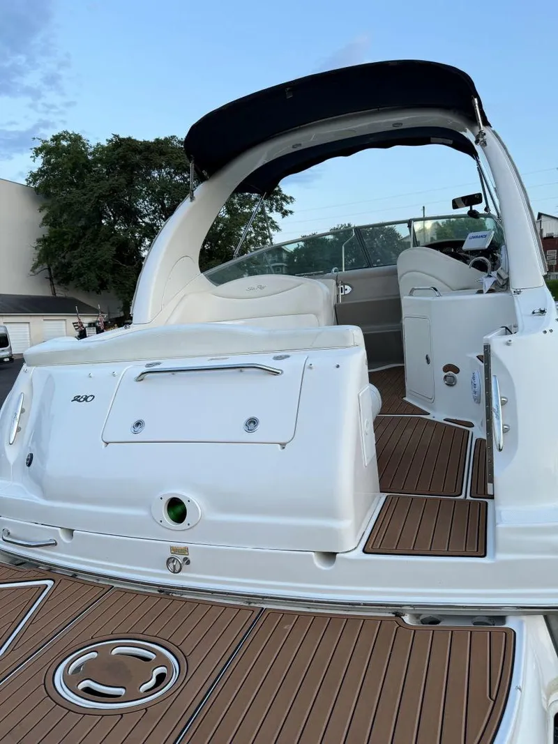Slide: The Image of 2006 Sea Ray 280 Sundancer boat with sleek design and spacious deck. - 13