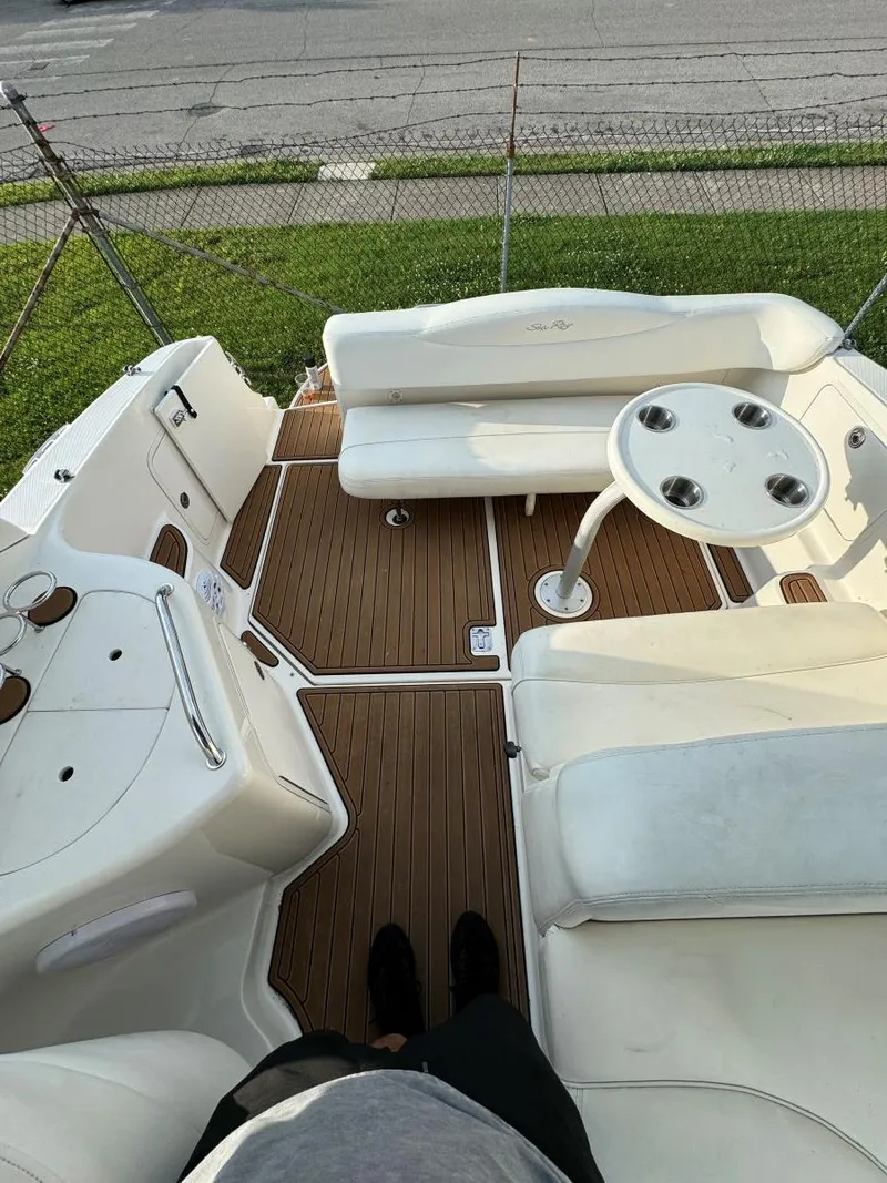 Slide: The Image of 2006 Sea Ray 280 Sundancer boat interior with seating and table. - 16