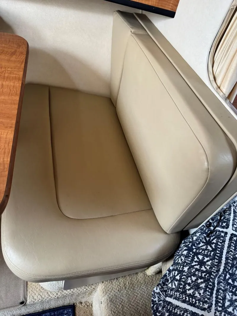 Slide: The Image of Beige leather seating in 2006 Sea Ray 280 Sundancer cabin interior. - 26