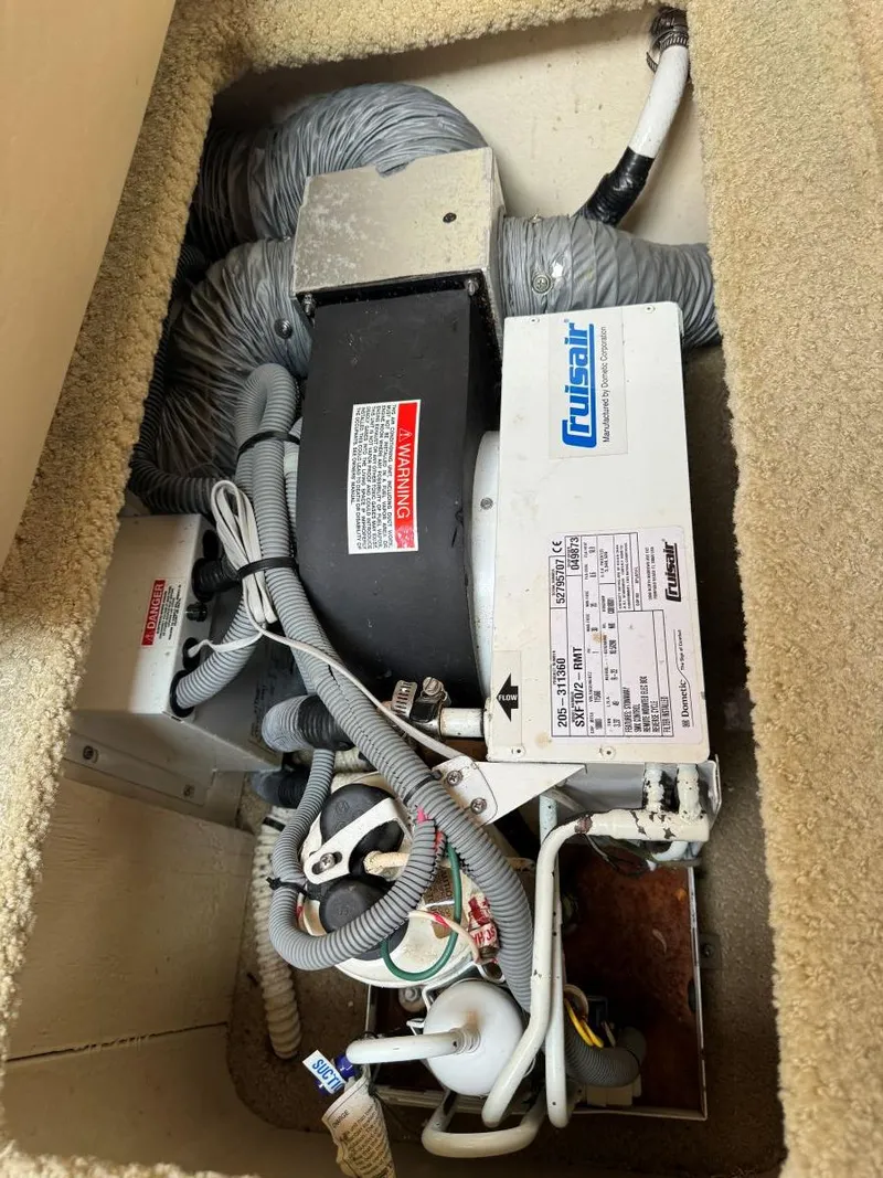 Slide: The Image of Cruisair unit in 2006 Sea Ray 280 Sundancer boat, showing wiring and components. - 30