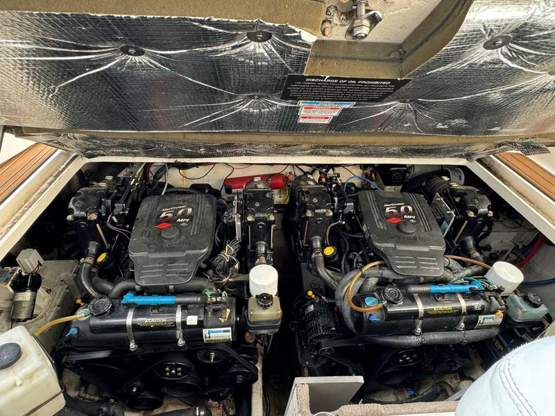 Slide: The Image of Engine compartment of a 2006 Sea Ray 280 Sundancer with dual engines. - 31