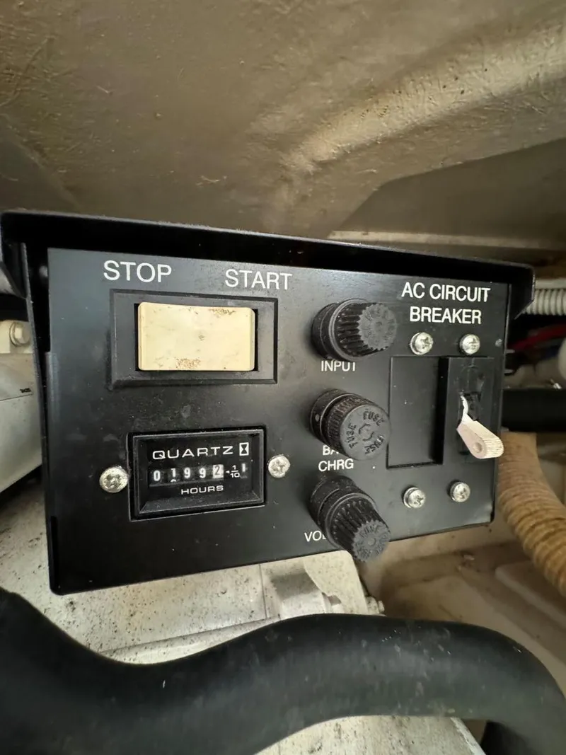 Slide: The Image of Control panel of a 2006 Sea Ray 280 Sundancer boat with AC circuit breaker. - 32