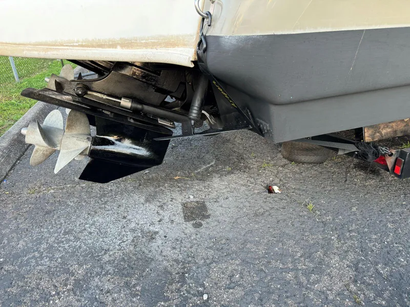 Slide: The Image of 2006 Sea Ray 280 Sundancer boat propeller and stern on pavement. - 35