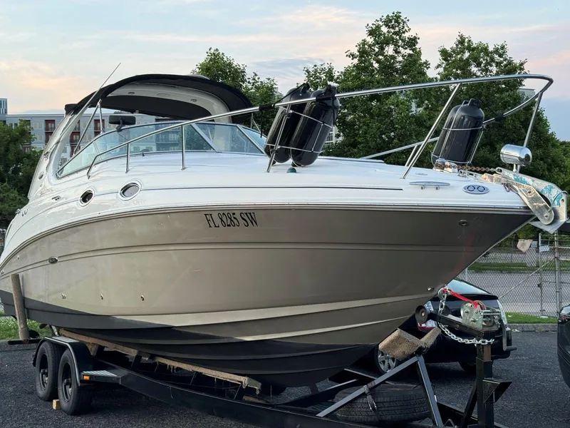 Slide: The Image of 2006 Sea Ray 280 Sundancer boat on trailer, parked outdoors. - 5