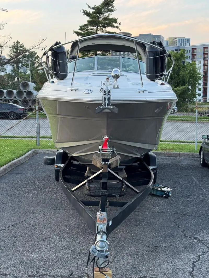 Slide: The Image of 2006 Sea Ray 280 Sundancer boat on trailer in parking lot. - 6