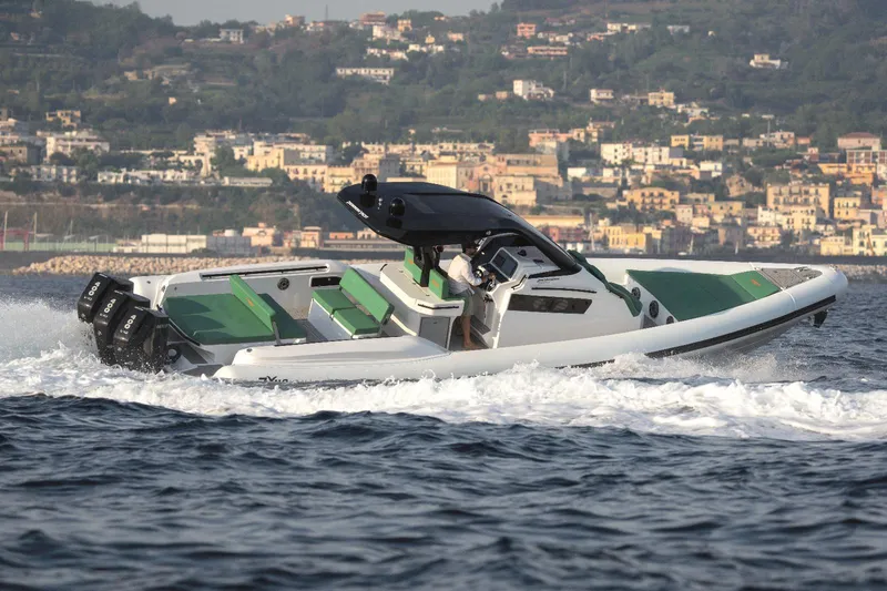 The Image of 2025 Panamera Yacht PY 110 Veloce cruising on the water with scenic coastal backdrop. - 0