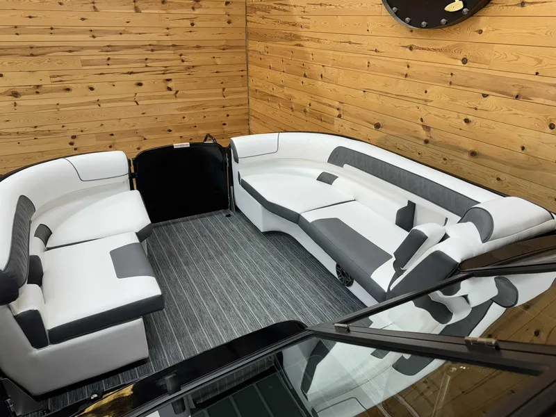 Slide: The Image of 2024 Premier 250 Super Sport boat interior with modern seating and wood paneling. - 9