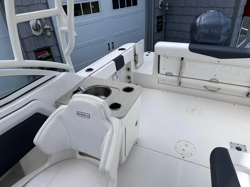 Slide: The Image of 2019 Robalo R247 Dual Console boat interior with seating and sink. - 20