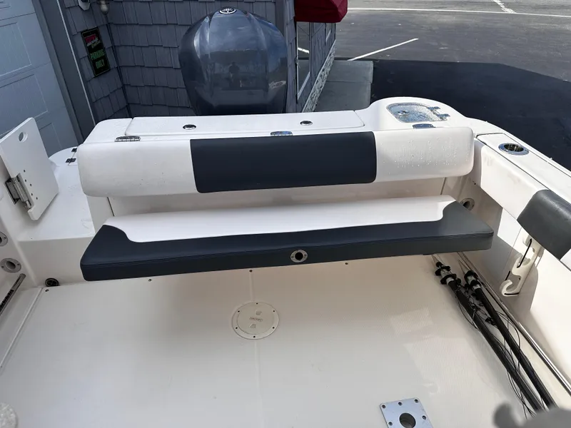 Slide: The Image of 2019 Robalo R247 Dual Console boat interior with seating and storage. - 21