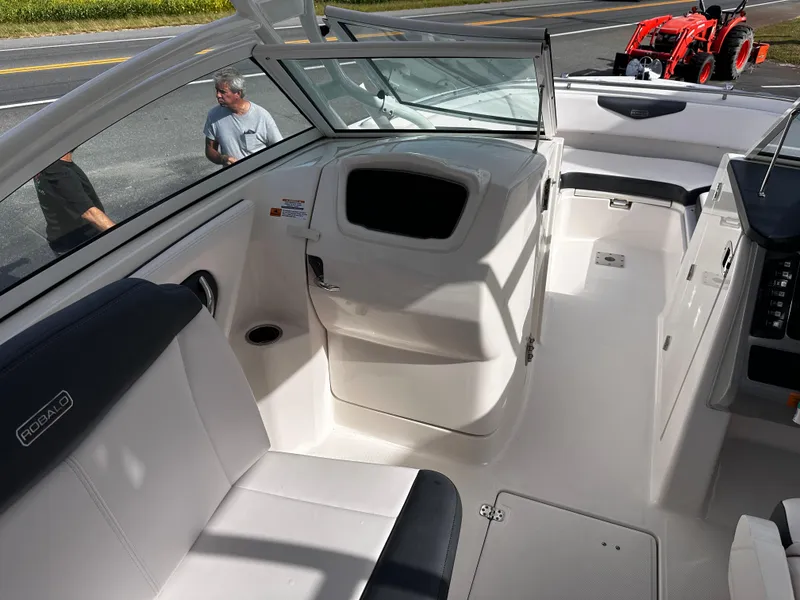 Slide: The Image of 2019 Robalo R247 Dual Console boat interior with seating and console view. - 23
