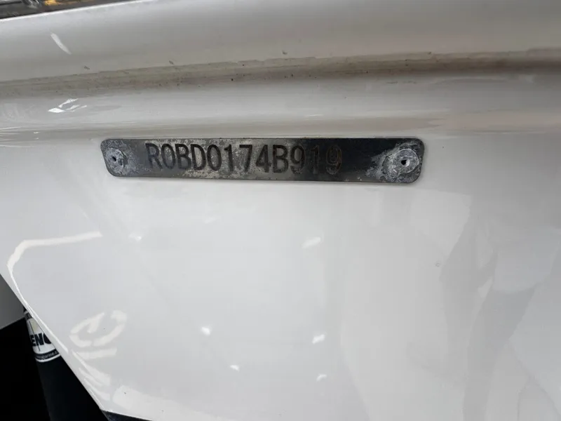 Slide: The Image of 2019 Robalo R247 Dual Console boat hull identification number plate. - 34