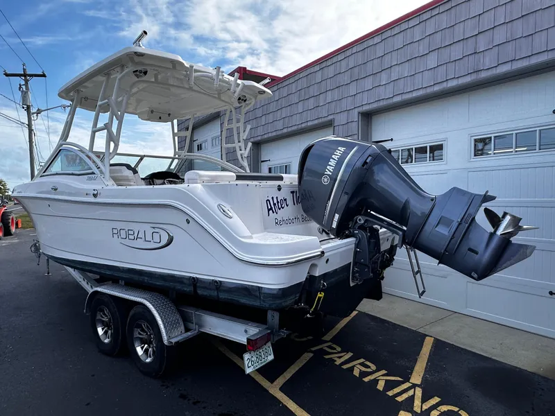 Slide: The Image of 2019 Robalo R247 Dual Console boat with Yamaha outboard motor on trailer. - 4
