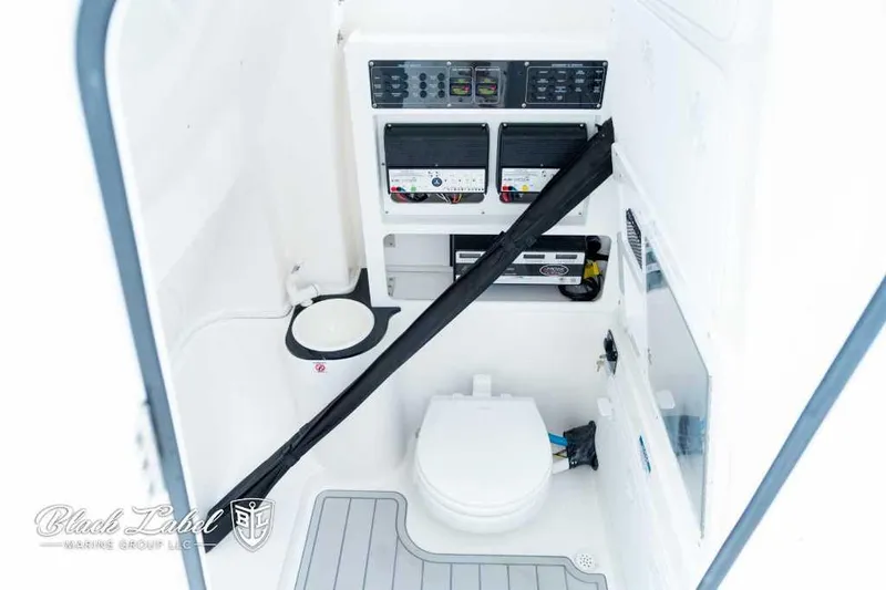 Slide: The Image of 2025 Sea Fox 288 Commander Center Console interior with control panels and marine toilet. - 13