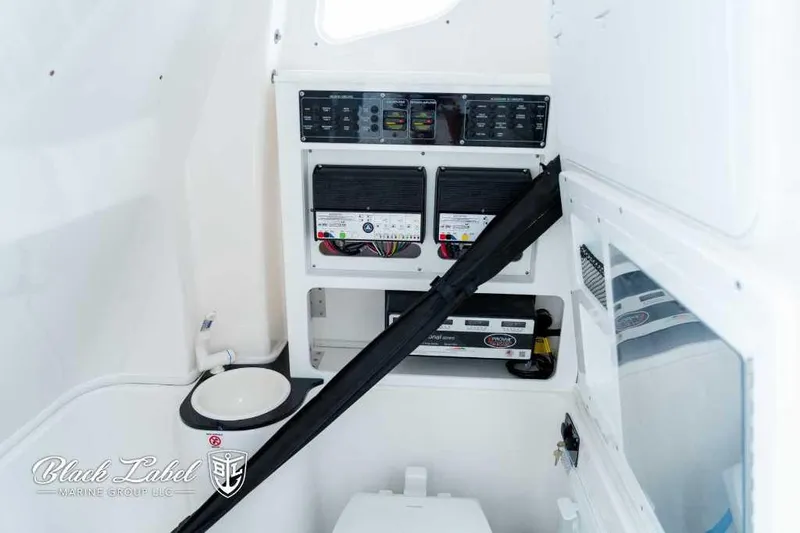 Slide: The Image of 2025 Sea Fox 288 Commander Center Console interior with control panels and storage. - 14