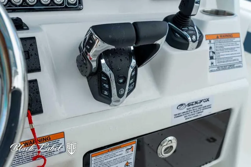 Slide: The Image of Close-up of 2025 Sea Fox 288 Commander Center Console controls and dashboard. - 20