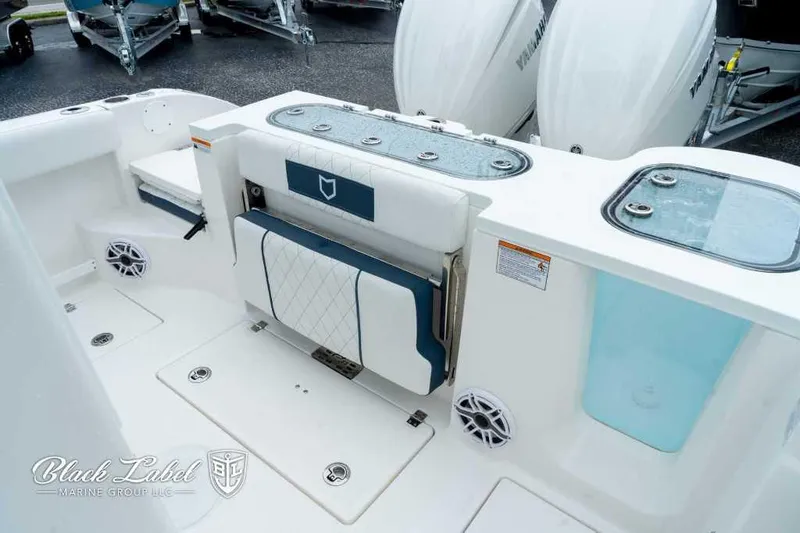 Slide: The Image of 2025 Sea Fox 288 Commander Center Console boat interior with seating and storage. - 22
