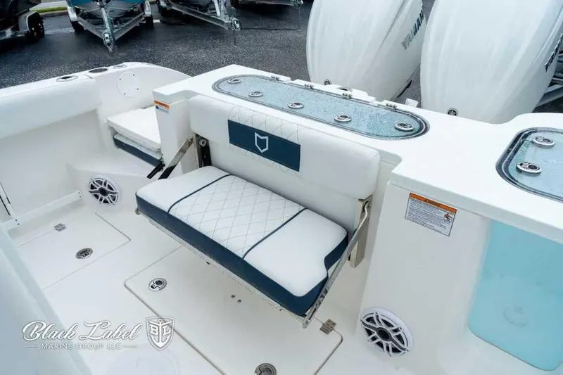 Slide: The Image of 2025 Sea Fox 288 Commander Center Console boat interior with seating and storage. - 23