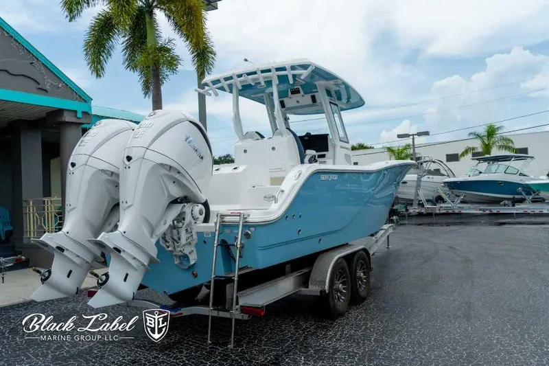 Slide: The Image of 2025 Sea Fox 288 Commander Center Console boat on trailer, displayed outdoors. - 3