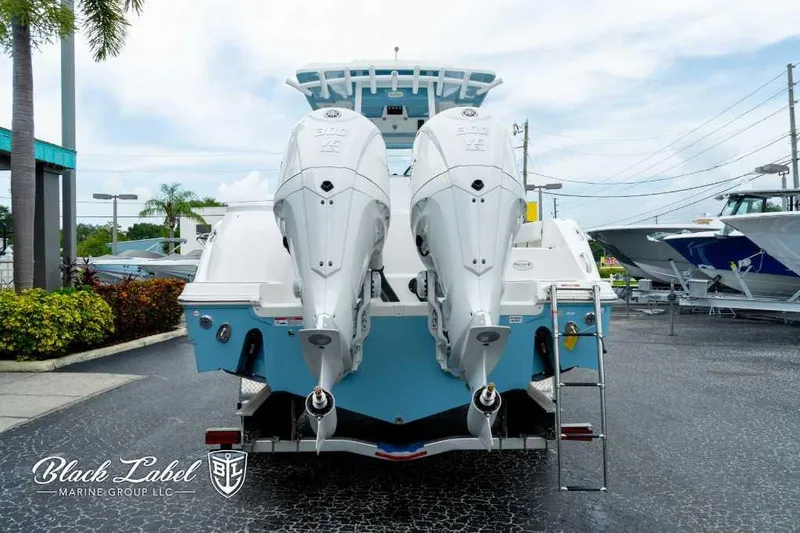 Slide: The Image of 2025 Sea Fox 288 Commander Center Console with twin engines, displayed at Black Label Marine. - 4
