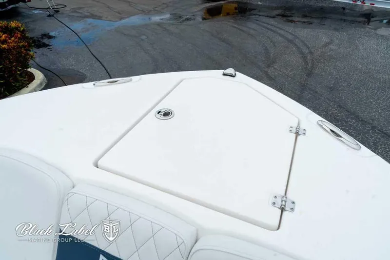 Slide: The Image of 2025 Sea Fox 288 Commander Center Console boat deck, featuring storage hatch. - 9
