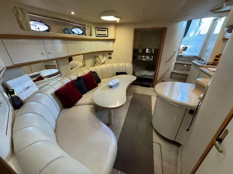 Slide: The Image of Luxurious interior of a 1997 Sea Ray 450 Sundancer yacht with plush seating and modern amenities. - 15
