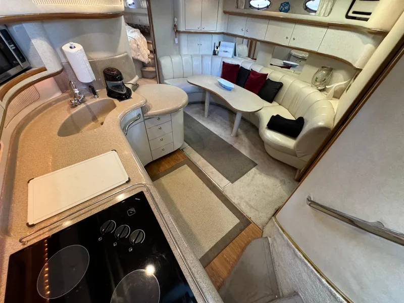 Slide: The Image of Luxurious interior of a 1997 Sea Ray 450 Sundancer yacht with modern amenities. - 17