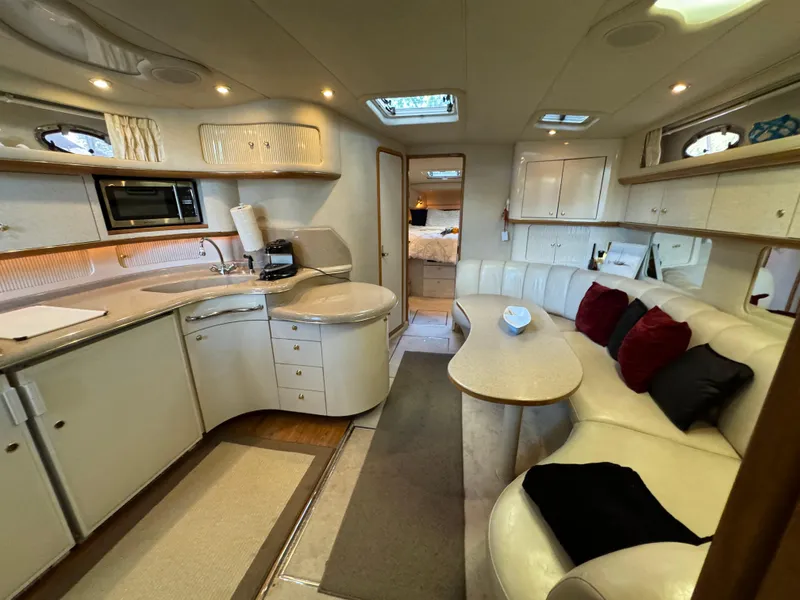 Slide: The Image of Luxurious interior of a 1997 Sea Ray 450 Sundancer yacht with modern amenities. - 22