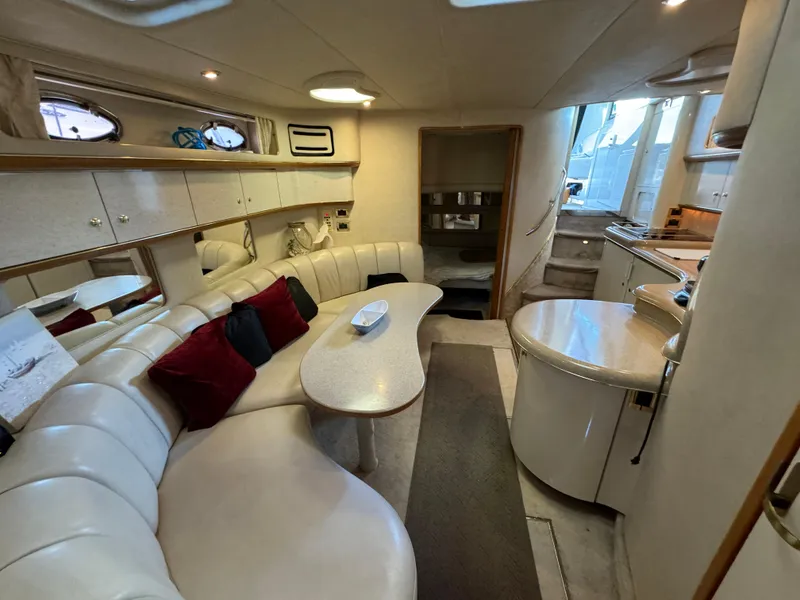 Slide: The Image of Luxurious interior of a 1997 Sea Ray 450 Sundancer yacht with elegant seating and modern amenities. - 23