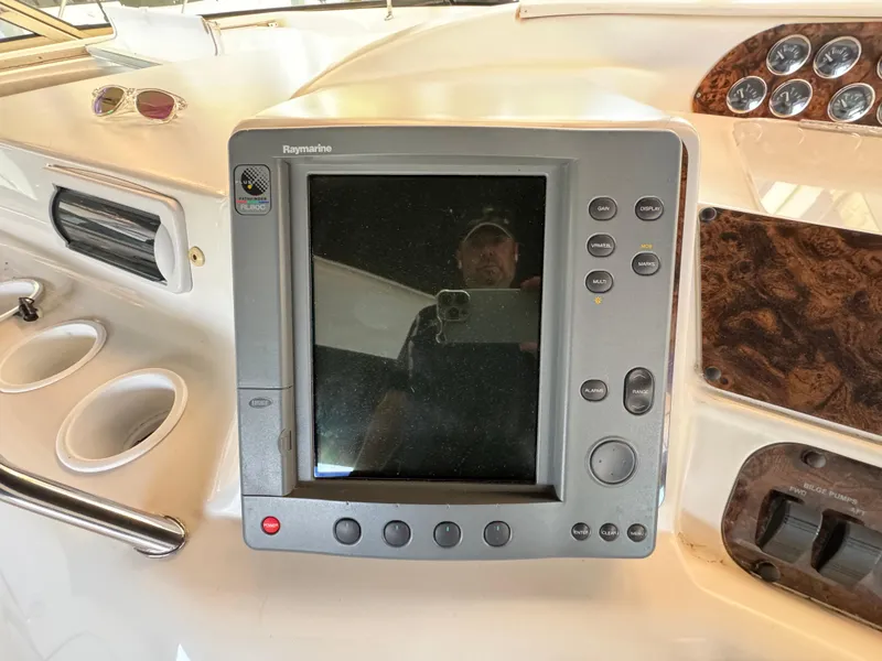 Slide: The Image of Control panel of a 1997 Sea Ray 450 Sundancer boat with navigation display. - 29