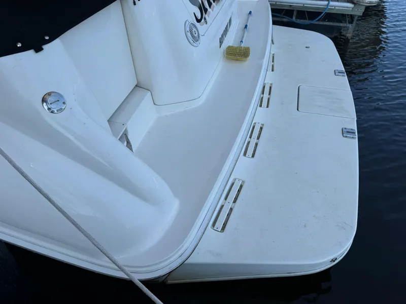 Slide: The Image of 1997 Sea Ray 450 Sundancer swim platform with docked boat view. - 6
