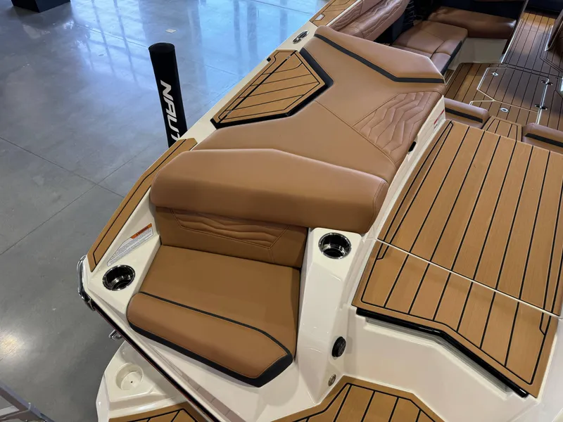 Slide: The Image of Luxurious seating in 2025 Nautique Super Air Nautique G23 boat. - 10