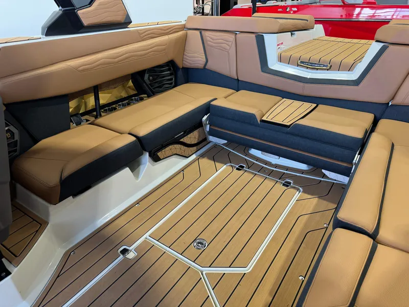 Slide: The Image of 2025 Nautique Super Air Nautique G23 interior with luxurious seating. - 13