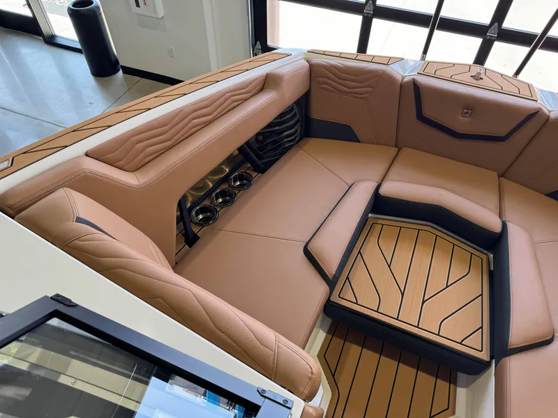Slide: The Image of 2025 Nautique Super Air Nautique G23 interior seating area. - 17