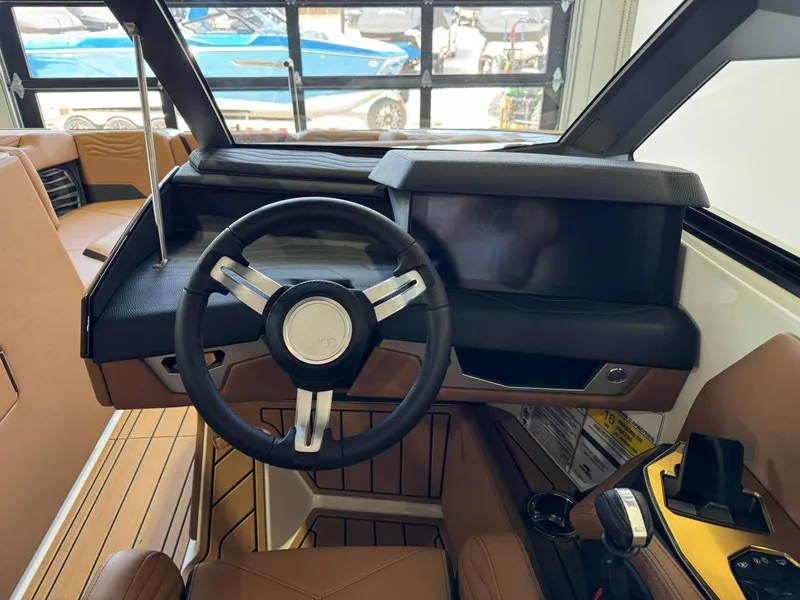 Slide: The Image of 2025 Nautique Super Air Nautique G23 cockpit interior view. - 24