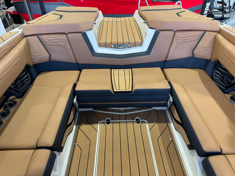 Slide: The Image of 2025 Nautique Super Air Nautique G23 interior with luxurious seating. - 25