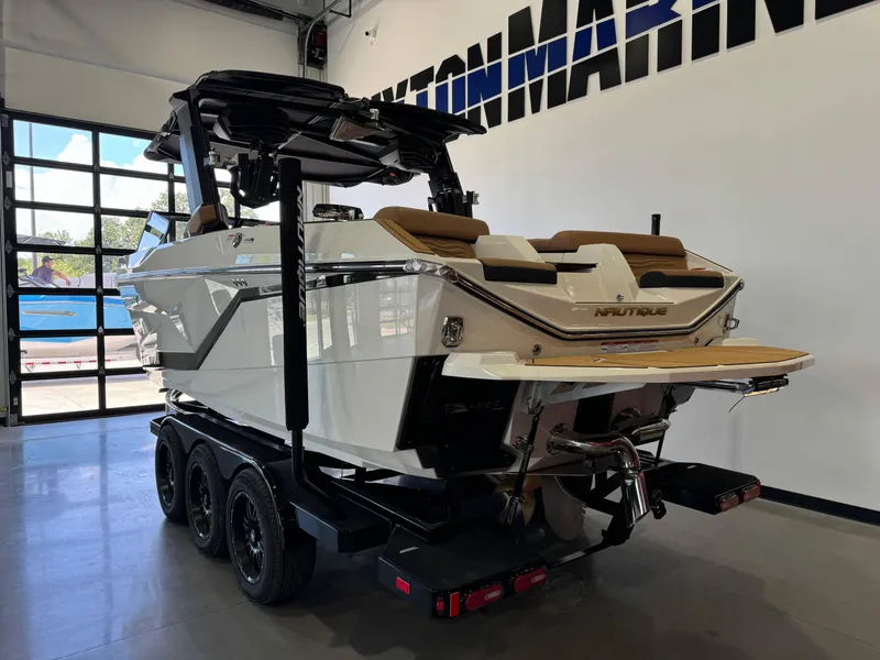Slide: The Image of 2025 Nautique Super Air Nautique G23 boat in showroom. - 6