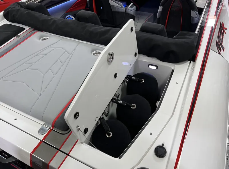 Slide: The Image of 2023 Daves Custom Boats M28R interior with open storage compartment, showcasing sleek design. - 10